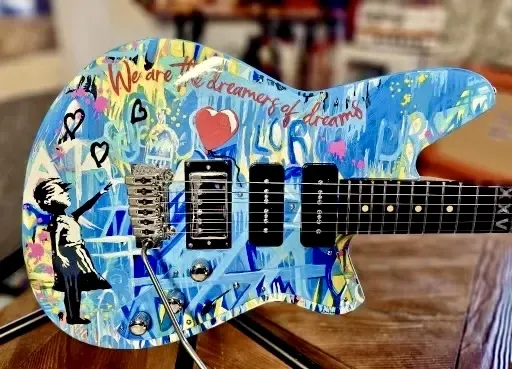 Banksy inspired painted guitar