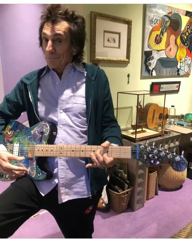 Ronnie Wood backstage with painted guitar