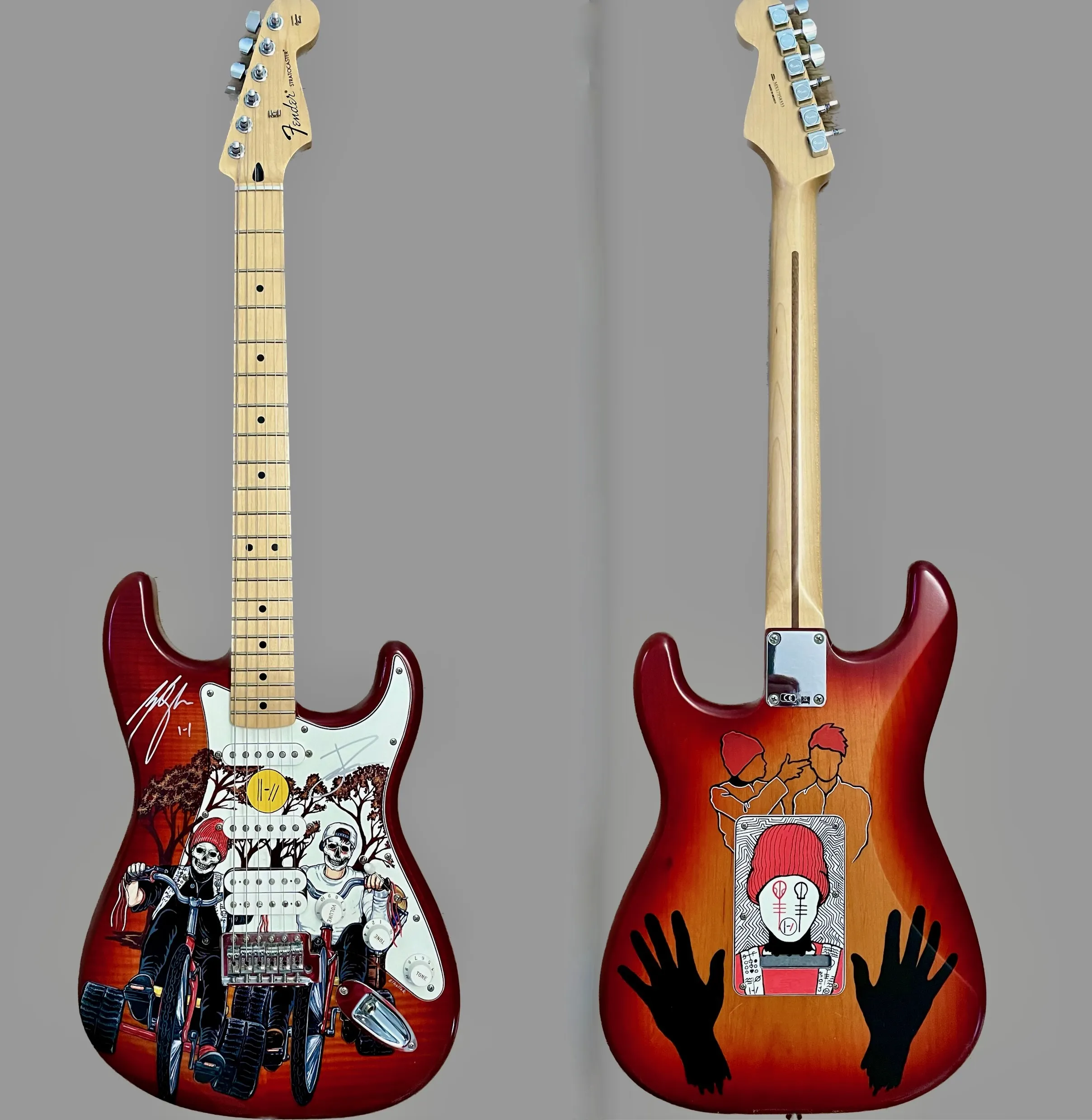 Pair of Twenty One Pilots painted guitars