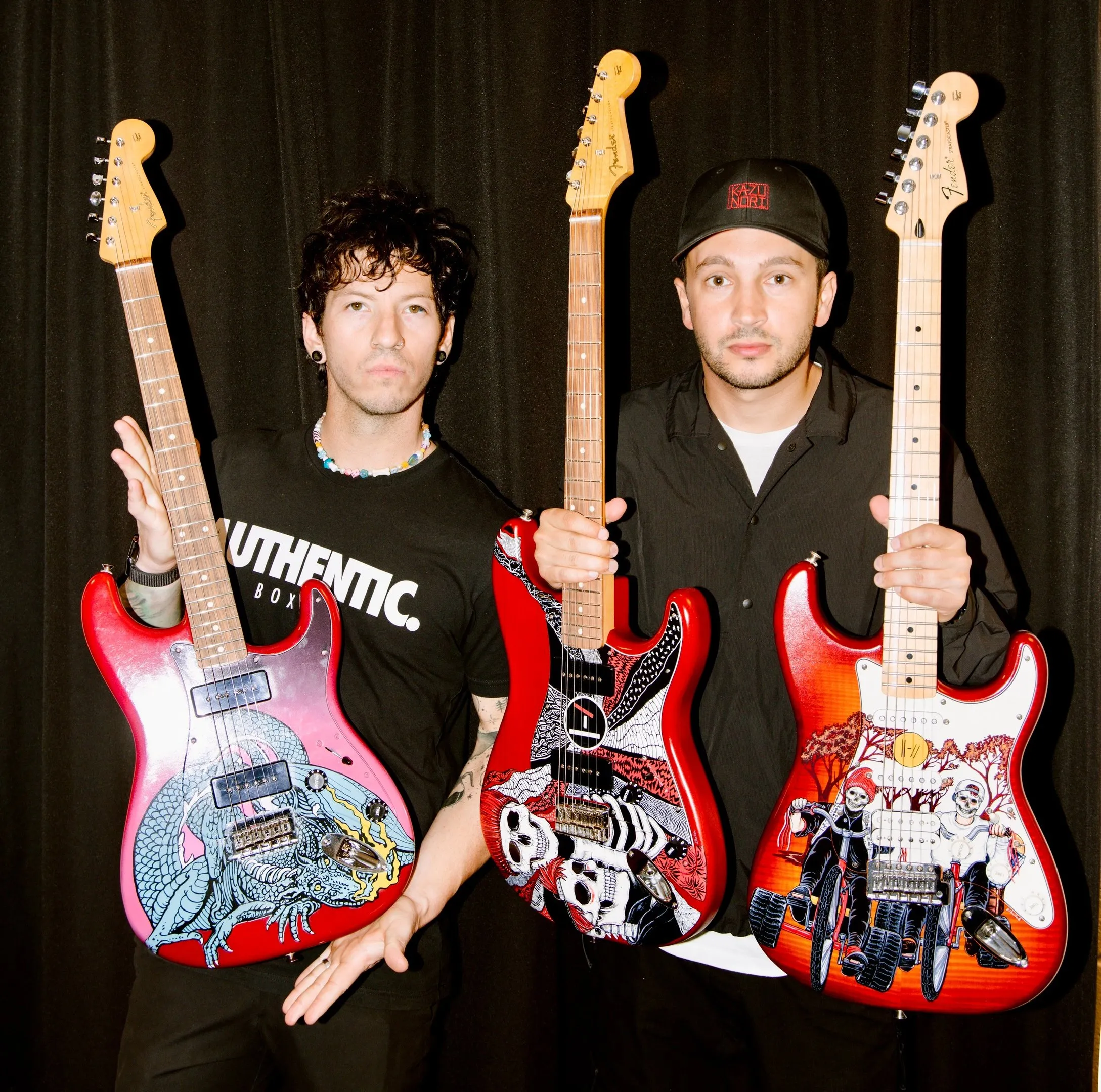 Tyler Joseph and Josh Dun with custom painted guitars
